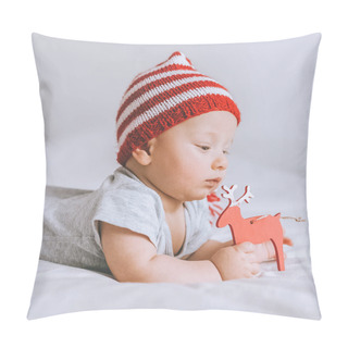 Personality  Close-up Portrait Of Infant Child In Knitted Striped Hat Playing With Toy Deer In Bed Pillow Covers
