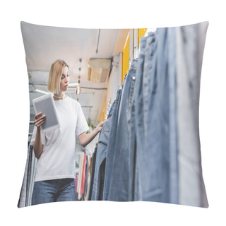 Personality  Low Angle View Of Pretty Saleswoman Looking At Jeans And Holding Digital Tablet In Second Hand  Pillow Covers