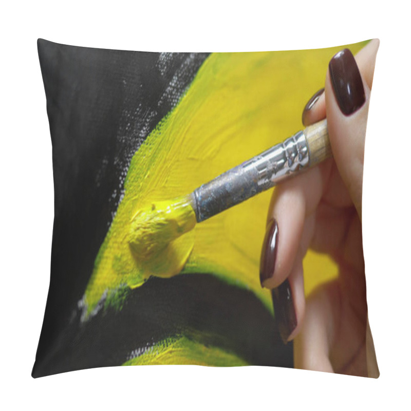 Personality  closeup. female hand painting with a brush painting on canvas with oil paints pillow covers