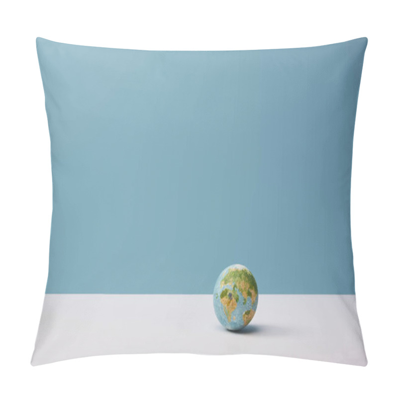 Personality  small globe on white table and blue background pillow covers