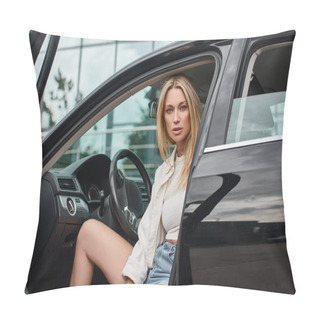 Personality  Trendy And Expressive Blonde Woman Sitting In Modern Car And Looking At Camera On City Street Pillow Covers