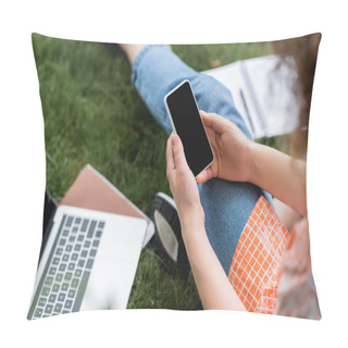 Personality  Cropped View Of Young Woman Holding Smartphone With Blank Screen While Sitting Near Laptop And Notebook On Grass  Pillow Covers