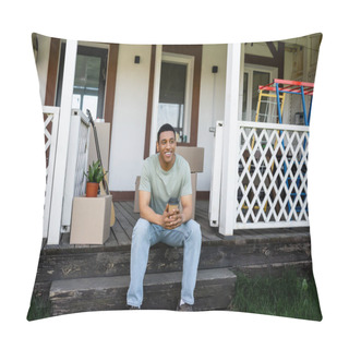 Personality  Smiling African American Man Holding Takeaway Coffee While Sitting On Porch Of New House Pillow Covers