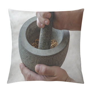 Personality  Hand Grinds The Dried Roots Of Medicinal Herbs In Stone Mortar. Caucasian Middle-aged Man. Alternative Medicine. Medicinal Herbs. Pillow Covers