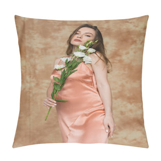 Personality  Brunette And Young Woman In Pink Silk Slip Dress Holding Eustoma Flowers While Standing And Looking At Camera On Mottled Beige Background, Sensuality, Elegance, Sophistication  Pillow Covers