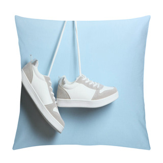 Personality  Modern Trendy Sneakers Hang On Laces On A Colored Background. Casual Shoes, Sports Shoes. Place To Insert Text. Pillow Covers