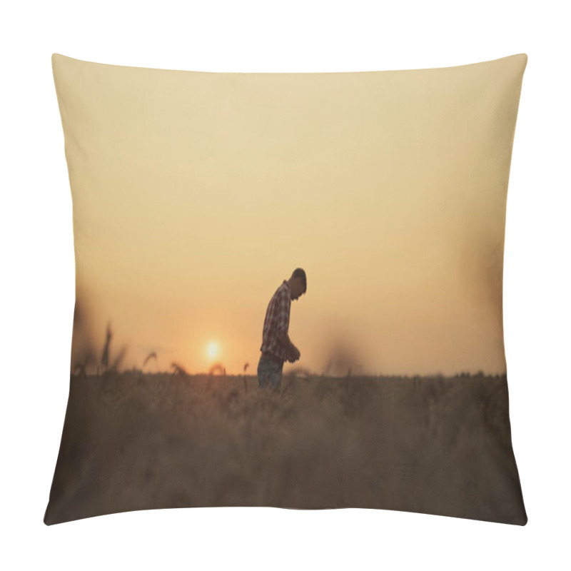 Personality  Farmer man silhouette examining wheat grain at sunset farmland rural background. pillow covers