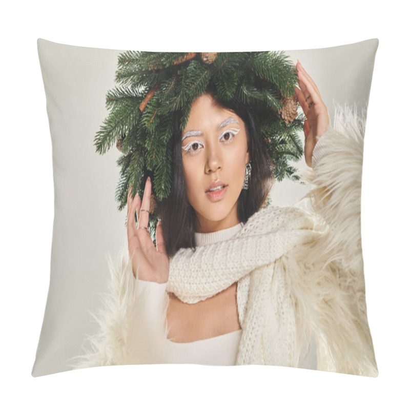 Personality  winter beauty, enchanted woman with natural pine wreath posing in white clothes on grey backdrop pillow covers