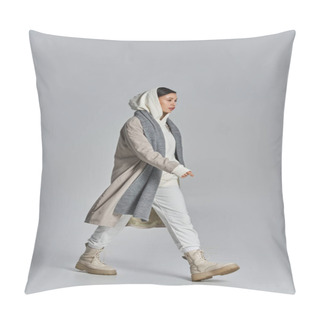 Personality  A Stylish Woman Walking In A Gray And White Outfit Within A Studio Setting. Pillow Covers