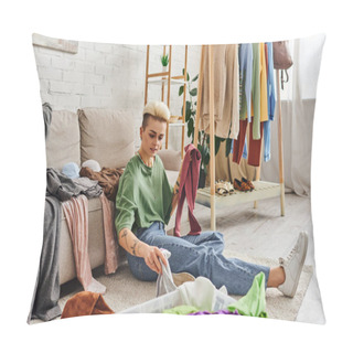 Personality  Tattooed Woman Sorting Wardrobe Items While Sitting On Floor In Living Room Near Couch And Rack With Clothes, Decluttering And Reducing, Sustainable Living And Mindful Consumerism Concept Pillow Covers