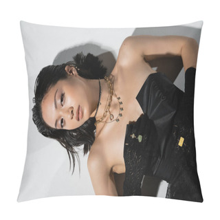 Personality  Top View Of Charming Asian Young Woman With Short Hair Lying In Black Gloves And Strapless Dress While Posing In Golden Jewelry On Grey Background, Wet Hairstyle, Natural Makeup, Looking At Camera Pillow Covers