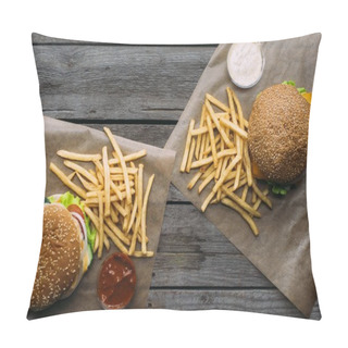 Personality  Top View Of Hamburgers, French Fries And Sauces On Baking Paper On Wooden Tabletop Pillow Covers