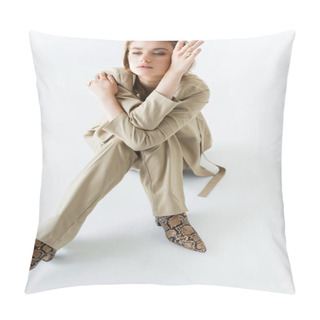 Personality  Stylish Model In Beige Suit And Boots With Animal Print Sitting On White Pillow Covers