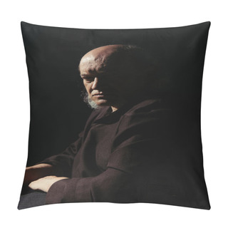 Personality  Serious And Thoughtful Priest Sitting And Looking At Camera Isolated On Black Pillow Covers