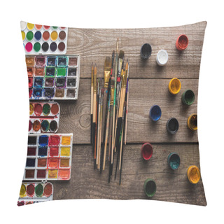 Personality  Top View Of Colorful Paint Palettes On Wooden Brown Surface With Paintbrushes And Gouache Pillow Covers