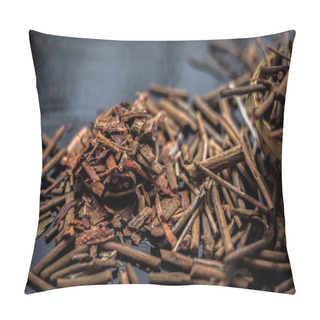 Personality  Bunch Of Indian Madderwort Or Madder Root In A Brown-colored Basket On The Black Wooden Surface Also Known As Manjistha/manzistha/Rubia Cordifolia/madder Etc With Its Powder In A Small Brown Plate. Pillow Covers