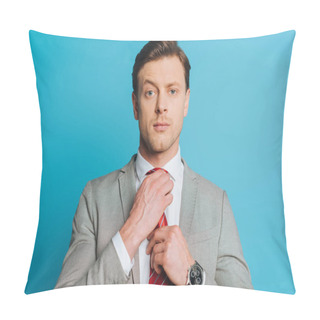 Personality  Handsome, Confident Businessman Touching Tie While Looking At Camera Isolated On Blue Pillow Covers