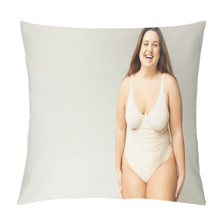 Personality  Portrait Of Happy And Curvy Woman With Plus Size Body Posing In Beige Bodysuit While Laughing On Grey Background, Body Positive, Figure Type, Looking At Camera While Standing In Studio  Pillow Covers