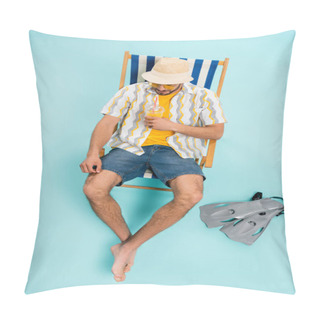 Personality  High Angle View Of Man In Straw Hat Holding Orange Juice Near Swimming Flippers On Blue Background  Pillow Covers