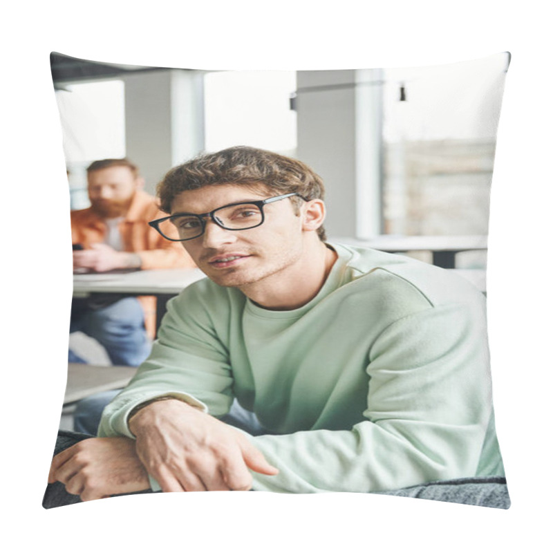 Personality  Positive And Ambitious Entrepreneur In Eyeglasses And Casual Clothes Looking At Camera While His Business Colleague Working On Blurred Background In Contemporary Office, Productive Coworking Concept Pillow Covers