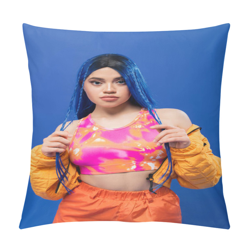 Personality  beauty trends, dyed hair, tattooed model with blue hair posing in puffer jacket on blue background, vibrant color, urban fashion, individualism, young woman looking at camera pillow covers