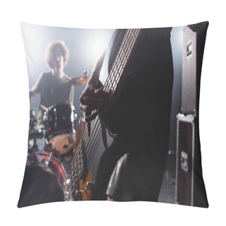Personality  KYIV, UKRAINE - AUGUST 25, 2020: Close Up View Of Female Musician Playing On Electric Guitar Near With Backlit And Blurred Drummer On Background Pillow Covers