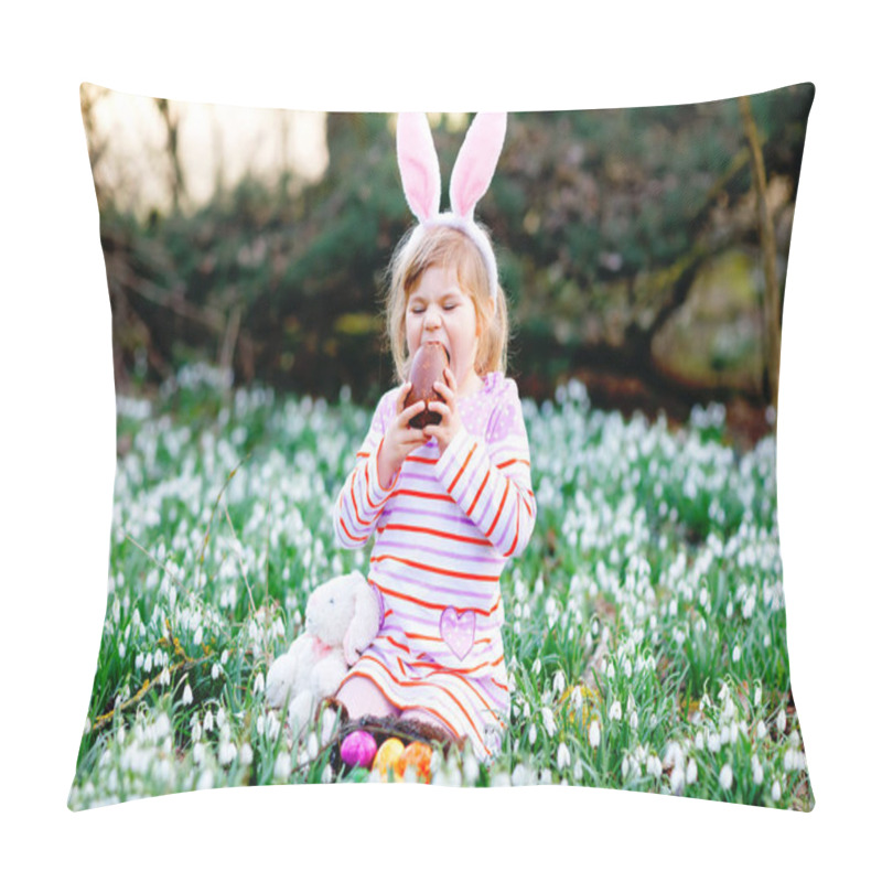 Personality  Little girl with Easter bunny ears making egg hunt in spring forest on sunny day, outdoors. Cute happy child with lots of snowdrop flowers, eating huge chocolate egg and colored eggs. pillow covers