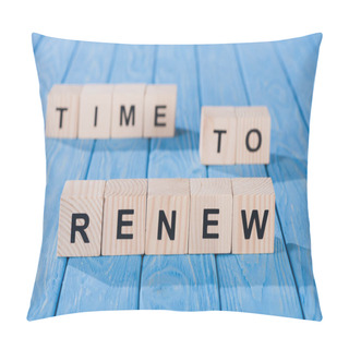Personality  Close Up View Of Arranged Wooden Blocks Into Time To Renew Phrase On Blue Wooden Surface  Pillow Covers