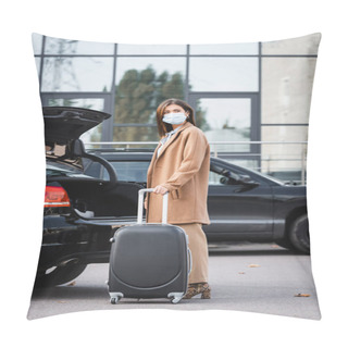Personality  Young Woman In Medical Mask And Stylish Autumn Outfit Looking Away While Standing Near Open Car Trunk Pillow Covers
