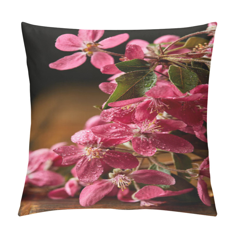 Personality  close-up shot of beautiful pink cherry blossom lying on wooden surface pillow covers