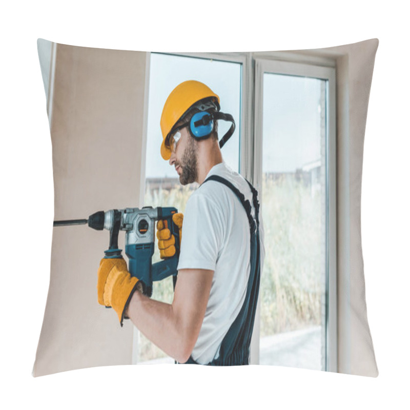 Personality  handyman in helmet and yellow gloves using hammer drill  pillow covers