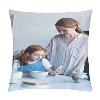 Personality  Happy Woman Looking At Daughter Using Smartphone During Breakfast Pillow Covers