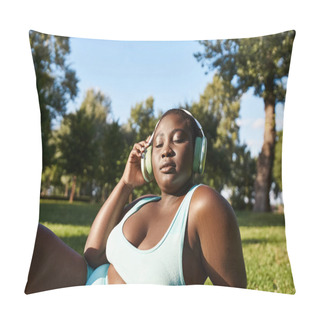 Personality  An African American Woman In Sportswear Lies On The Grass, Deeply Immersed In Her Music. Pillow Covers