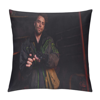 Personality  Confident Man With Scratched Face Reloading Gun And Looking At Camera In Dark Underground Tunnel Pillow Covers