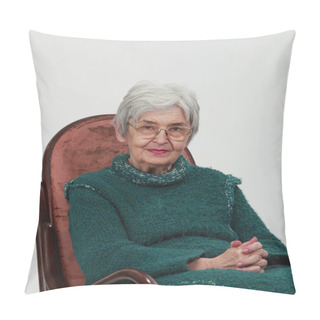 Personality Portrait Of An Old Woman Sitting On A Wooden Rocking Chair With Fingers Crossed, Against A Grey Background. Pillow Covers