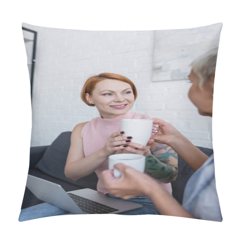 Personality  Blurred Woman Giving Tea Cup To Smiling Girlfriend Sitting On Couch With Laptop Pillow Covers