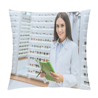 Personality  Beautiful Smiling Oculist Holding Papers And Pen In Ophthalmic Shop Pillow Covers