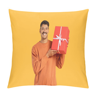 Personality  Man In Orange Sweater Seemingly Offering A Red Gift Box With A Bright Smile And A Sense Of Anticipation Pillow Covers