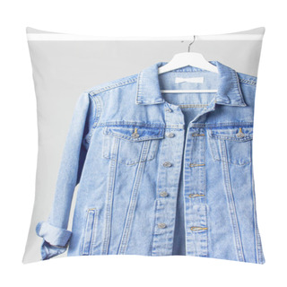 Personality  Blue Denim Jacket On White Wooden Coat Hanger On A Rod Against Light Gray Wall Flat Lay Copy Space. Denim, Fashionable Jacket, Women's Or Men's Trend Clothing, Fashion Background. Store Concept, Sale Pillow Covers