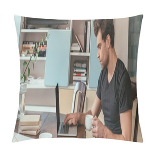 Personality  Side View Of Concentrated Man Holding Cup Of Coffee While Working On Laptop At Home, Panoramic Shot Pillow Covers