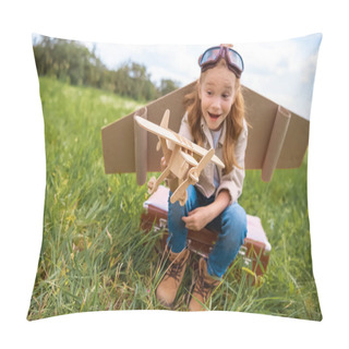 Personality  Emotional Kid In Pilot Costume With Wooden Toy Plane In Hand Sitting On Retro Suitcase In Field Pillow Covers
