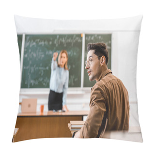 Personality  Selective Focus Of Young Student Sitting In Classroom With Teacher On Background  Pillow Covers