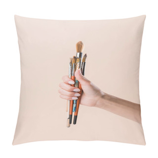 Personality  Cropped Shot Of Woman Holding Bunch Of Paint Brushes Isolated On Beige Pillow Covers
