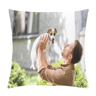 Personality  Young Man Raising Jack Russell Terrier Dog On Hands While Standing Outdoors Pillow Covers