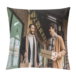 Personality  Cheerful Man With Shoebox Looking At Bearded Boyfriend Holding Shopping Bags Near Building With Showcases Pillow Covers