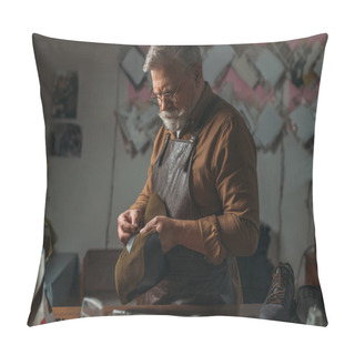 Personality  Selective Focus Of Senior Cobbler Holding Piece Of Genuine Leather In Workshop Pillow Covers