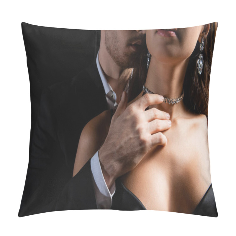 Personality  cropped view of man in black blazer and white shirt sensually holding hand on neck of seductive woman isolated on black pillow covers