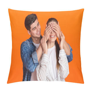 Personality  Young Guy Stands Behind Lady And Closes Eyes Of Smiling Woman Isolated On Orange Background Pillow Covers