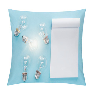 Personality  Top View Of Blank Notebook With Light Bulbs On Blue Background, Having New Idea Concept Pillow Covers