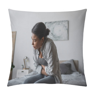 Personality  Tired Multiracial Woman Feeling Cramp In Stomach While Sitting On Bed  Pillow Covers